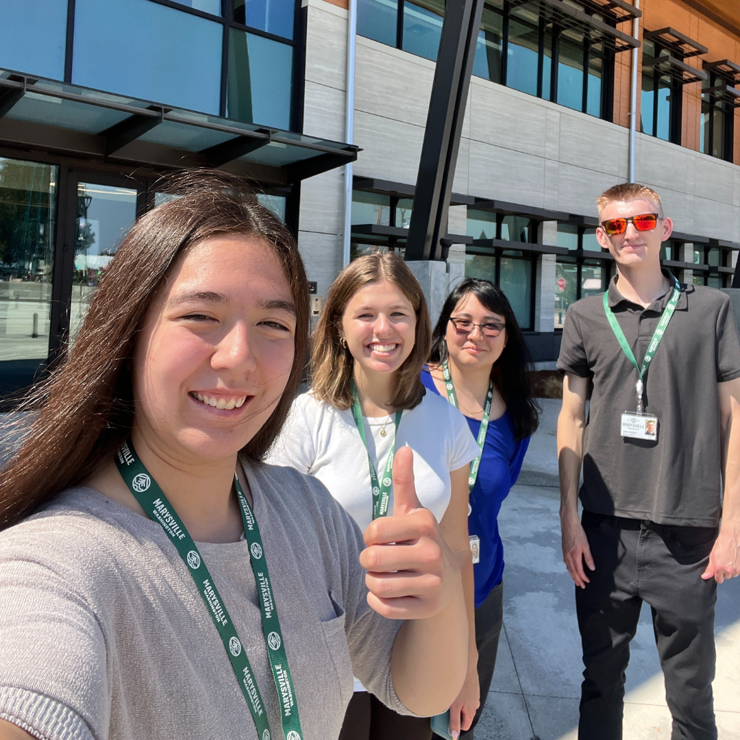 4 smiling summer interns for City of Marysville, WA, outside Civic Center