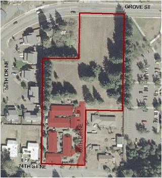 Aerial map of a parcel of land, where the parcel is outlined in red as a sample for fee calculation.