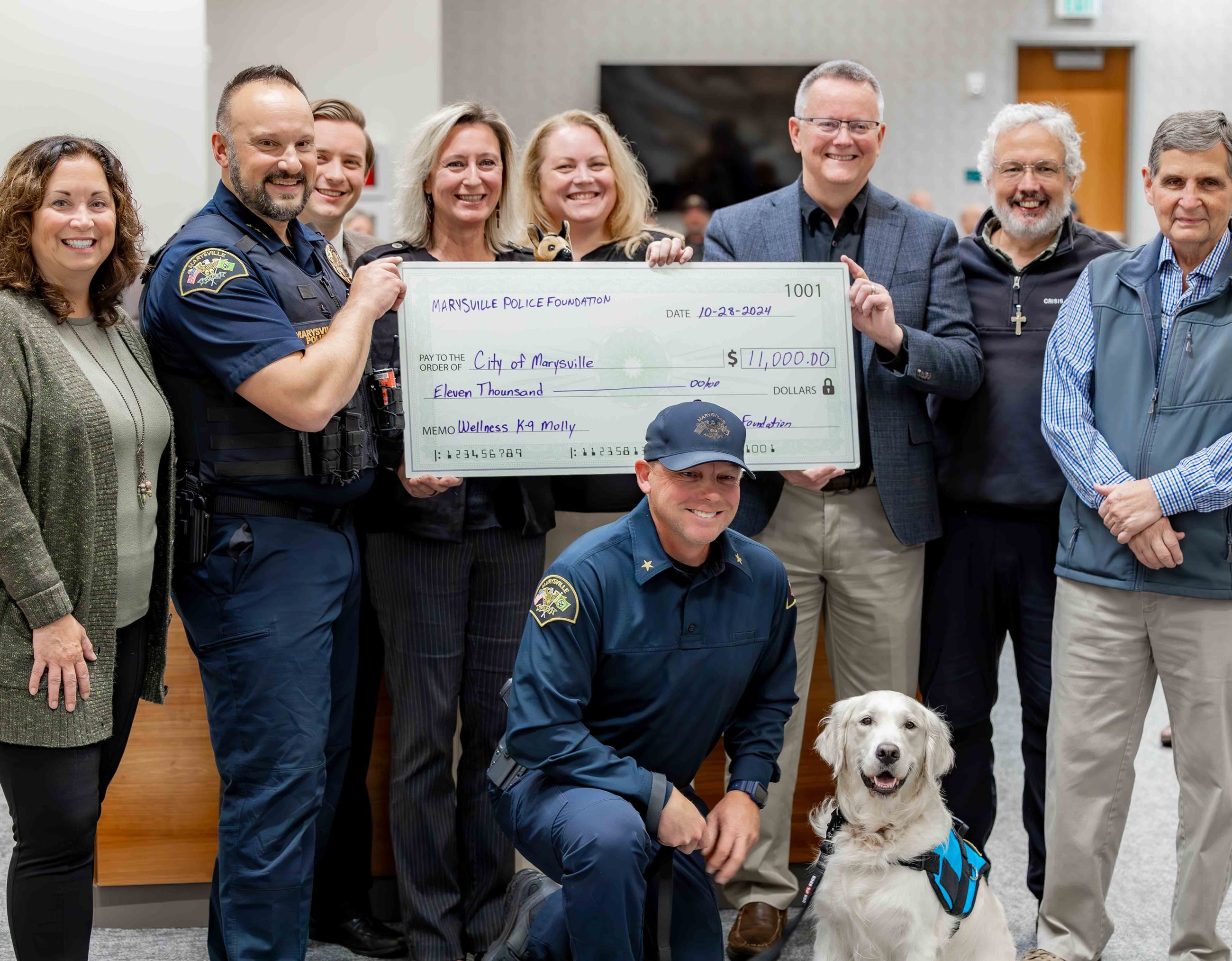 Marysville Police Foundation check presentation with Molly