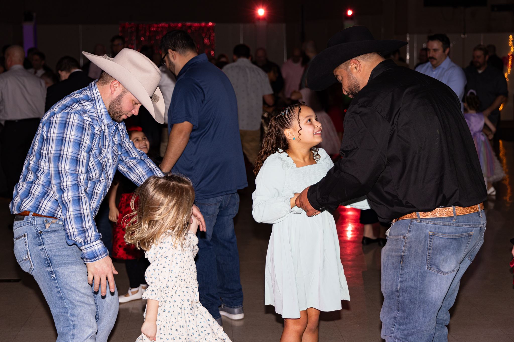 Fathers and daughters dancing together at the Father-Daughter Valentine's Dance.